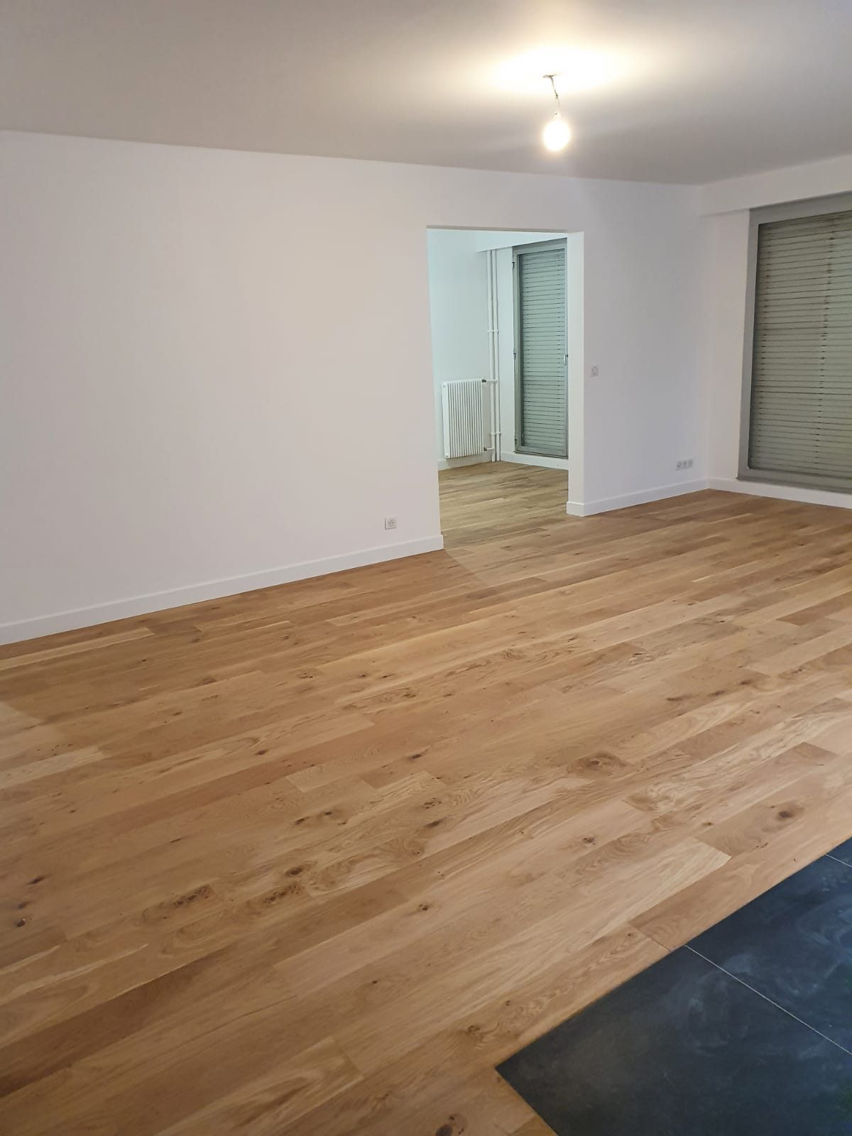 Après : couloir rénové - rénovation complète appartement Paris 12 rue Lasson